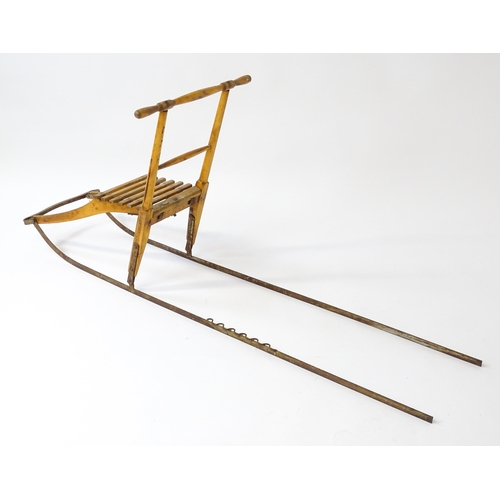 1236 - An early 20thC Norwegian kicksled. Bears remains of original label. Approx. 69