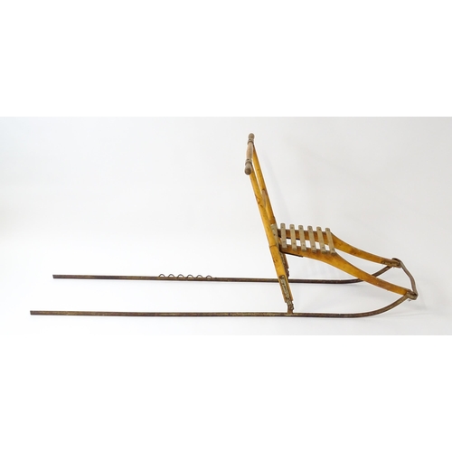 1236 - An early 20thC Norwegian kicksled. Bears remains of original label. Approx. 69