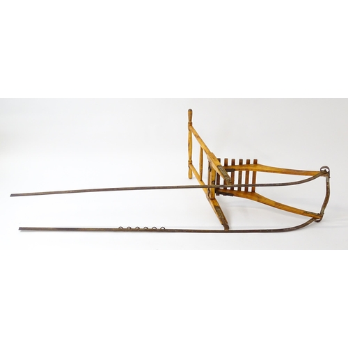 1236 - An early 20thC Norwegian kicksled. Bears remains of original label. Approx. 69