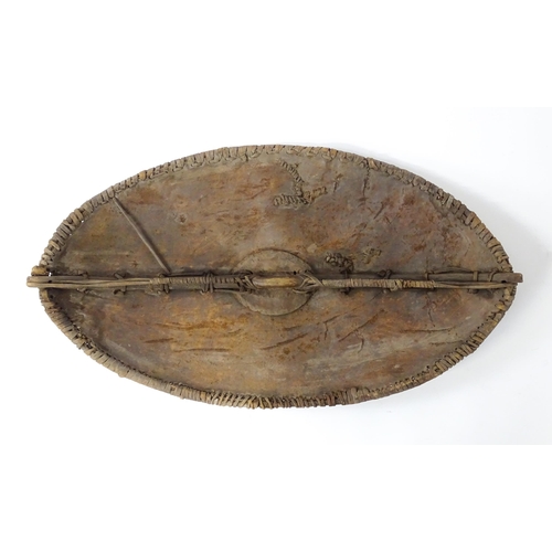 1238 - Ethnographic / Native / Tribal : An African Maasai Kenya hide shield of lozenge form, with traces of... 