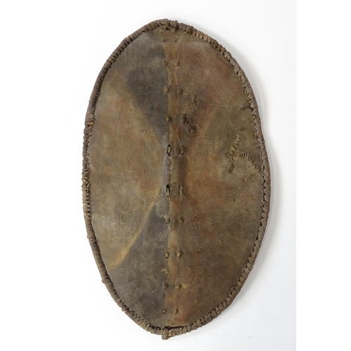 1238 - Ethnographic / Native / Tribal : An African Maasai Kenya hide shield of lozenge form, with traces of... 