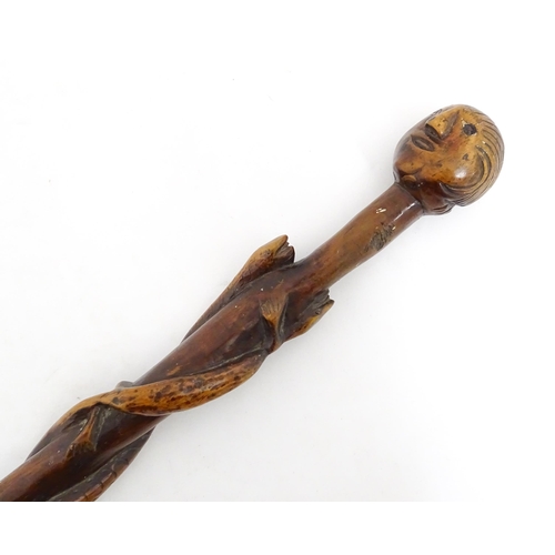 1242 - A late 19th / early 20thC hardwood walking stick / cane with folk art carved snake and lizard decora... 