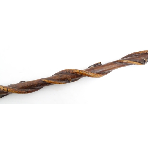 1242 - A late 19th / early 20thC hardwood walking stick / cane with folk art carved snake and lizard decora... 