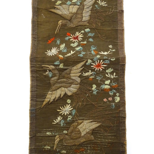 1253 - An Oriental embroidered scroll decorated with birds, flowers and foliage. Together with a Chinese sc... 