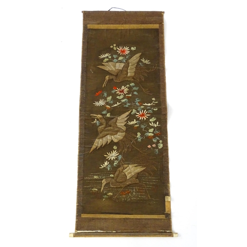 1253 - An Oriental embroidered scroll decorated with birds, flowers and foliage. Together with a Chinese sc... 