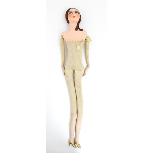 1277 - Toy: A 20thC French cloth boudoir doll body, with straw filled body and bisque hands and lower legs.... 