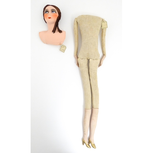 1277 - Toy: A 20thC French cloth boudoir doll body, with straw filled body and bisque hands and lower legs.... 