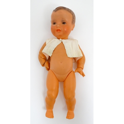 1286 - Toys: Five assorted dolls to include a French composite doll with blinking eyes, painted features an... 