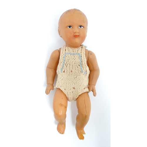 1286 - Toys: Five assorted dolls to include a French composite doll with blinking eyes, painted features an... 