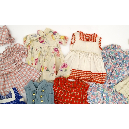 1287 - A large quantity of dolls clothing to include knitted cardigans, dresses, summer dresses, bonnets, e... 