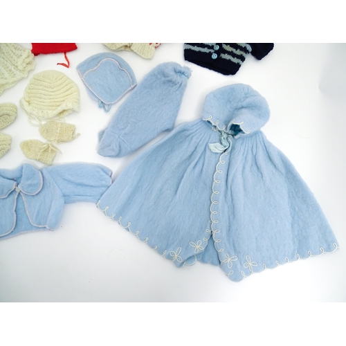 1287 - A large quantity of dolls clothing to include knitted cardigans, dresses, summer dresses, bonnets, e... 