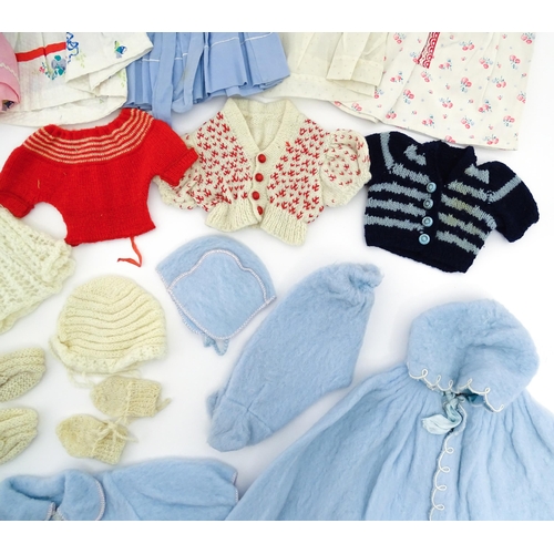 1287 - A large quantity of dolls clothing to include knitted cardigans, dresses, summer dresses, bonnets, e... 