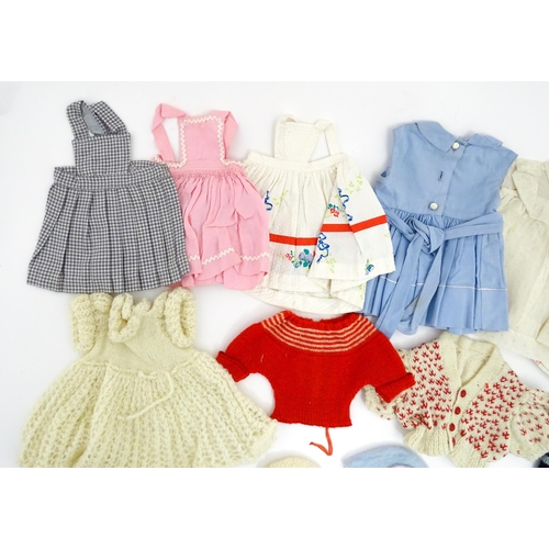 1287 - A large quantity of dolls clothing to include knitted cardigans, dresses, summer dresses, bonnets, e... 