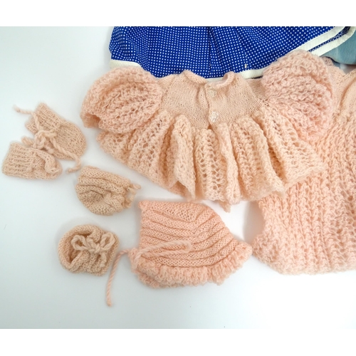 1287 - A large quantity of dolls clothing to include knitted cardigans, dresses, summer dresses, bonnets, e... 