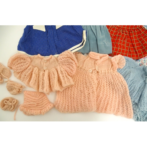 1287 - A large quantity of dolls clothing to include knitted cardigans, dresses, summer dresses, bonnets, e... 