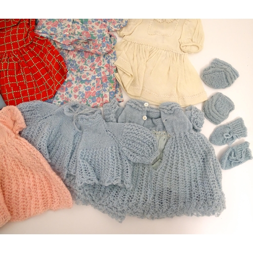 1287 - A large quantity of dolls clothing to include knitted cardigans, dresses, summer dresses, bonnets, e... 