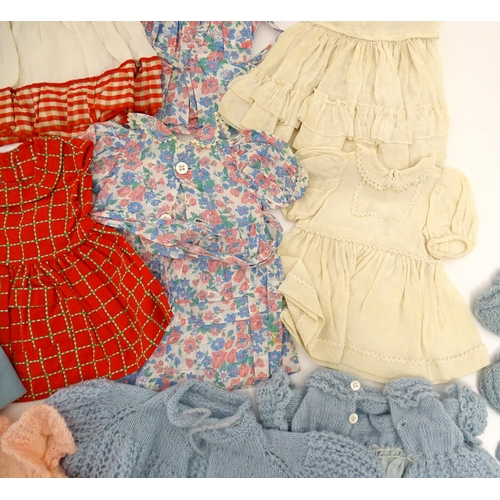 1287 - A large quantity of dolls clothing to include knitted cardigans, dresses, summer dresses, bonnets, e... 