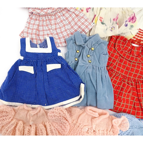 1287 - A large quantity of dolls clothing to include knitted cardigans, dresses, summer dresses, bonnets, e... 