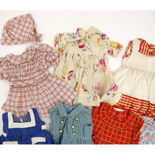 1287 - A large quantity of dolls clothing to include knitted cardigans, dresses, summer dresses, bonnets, e... 