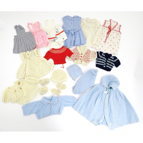 1287 - A large quantity of dolls clothing to include knitted cardigans, dresses, summer dresses, bonnets, e... 