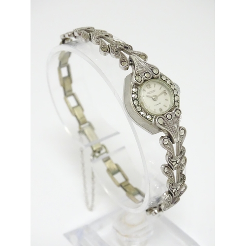 809 - A ladies Rotary cocktail watch with Marcasite detail. Approx 3/4