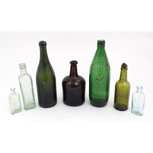 234 - Seven assorted glass bottles to include a late 17th / early 18thC dark olive mallet bottle, Stephen ... 