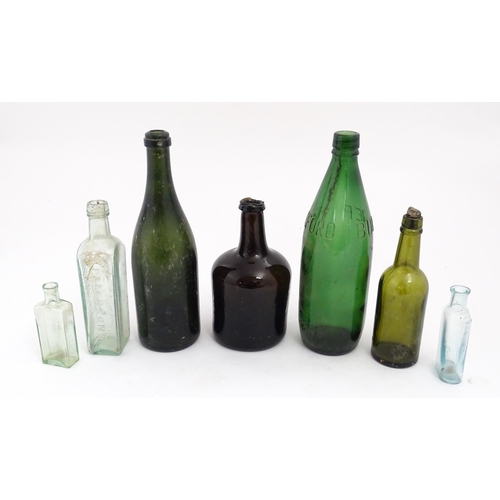 234 - Seven assorted glass bottles to include a late 17th / early 18thC dark olive mallet bottle, Stephen ... 