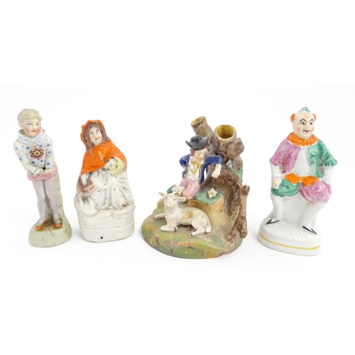 54 - Four assorted ceramic figures to include a Staffordshire pottery Red Riding Hood, a small clown figu... 