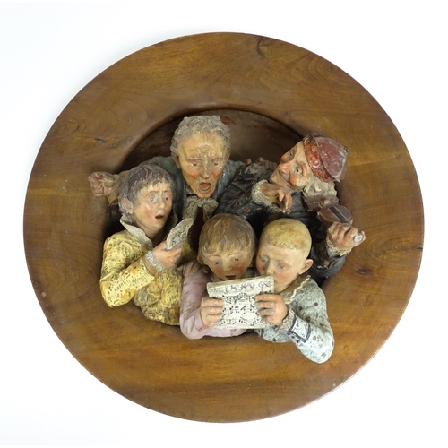 1231 - A large Austrian terracotta relief plaque depicting a choir and musicians, with circular wooden moun... 