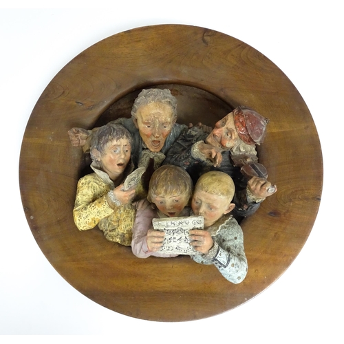 1231 - A large Austrian terracotta relief plaque depicting a choir and musicians, with circular wooden moun... 