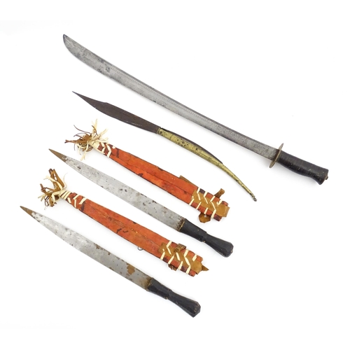 1239 - Four assorted blades, comprising an early 20thC Liuyedao / Yanglindao style sword, a pair of Shona k... 