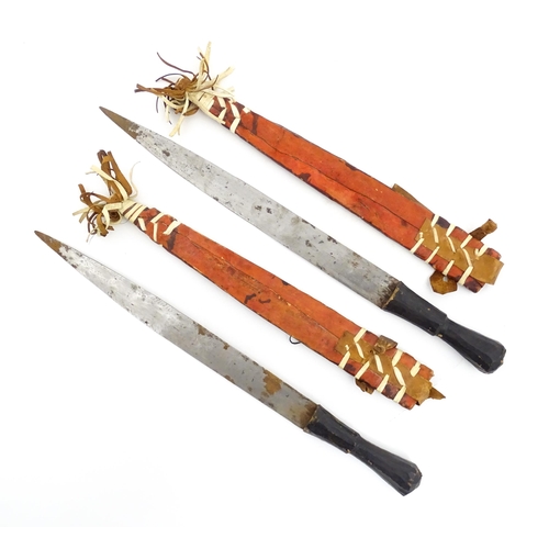 1239 - Four assorted blades, comprising an early 20thC Liuyedao / Yanglindao style sword, a pair of Shona k... 