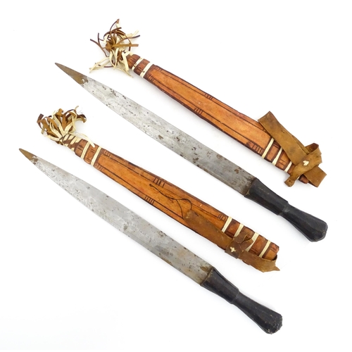 1239 - Four assorted blades, comprising an early 20thC Liuyedao / Yanglindao style sword, a pair of Shona k... 