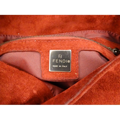 1263 - Vintage fashion / clothing: A Fendi Mamma Baguette handbag in red suede, numbered 2579-8BR001.019. A... 