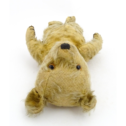 1270 - Toy: A 20thC teddy bear with stitches nose and claws, and articulated limbs. Approx. 16 1/4