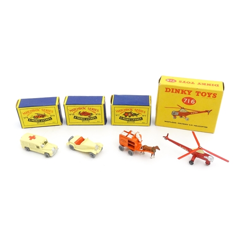 1272 - Toys: A boxed Dinky Toys die cast scale model of a helicopter no. 716. Together with three Moko Lesn... 