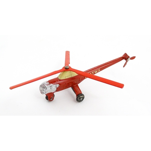 1272 - Toys: A boxed Dinky Toys die cast scale model of a helicopter no. 716. Together with three Moko Lesn... 