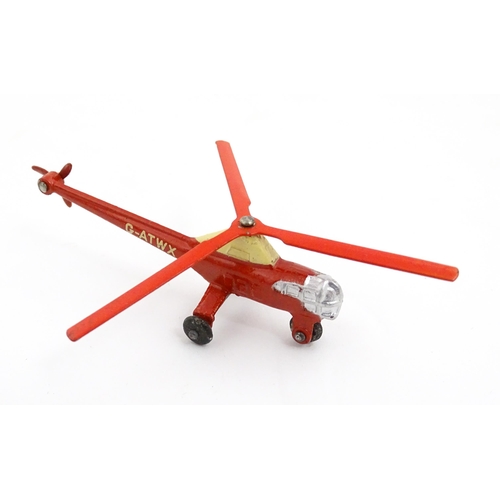 1272 - Toys: A boxed Dinky Toys die cast scale model of a helicopter no. 716. Together with three Moko Lesn... 