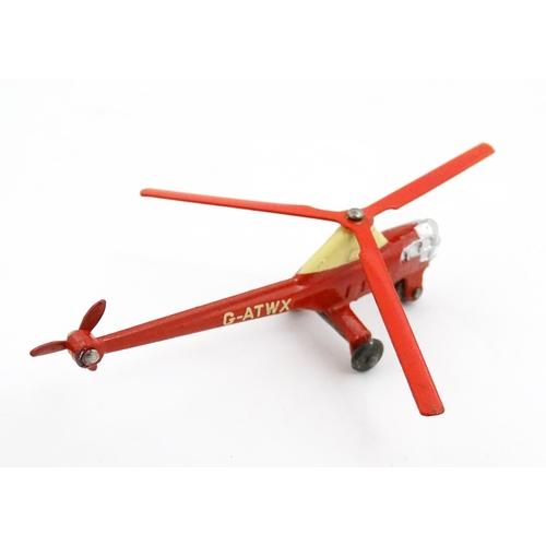 1272 - Toys: A boxed Dinky Toys die cast scale model of a helicopter no. 716. Together with three Moko Lesn... 