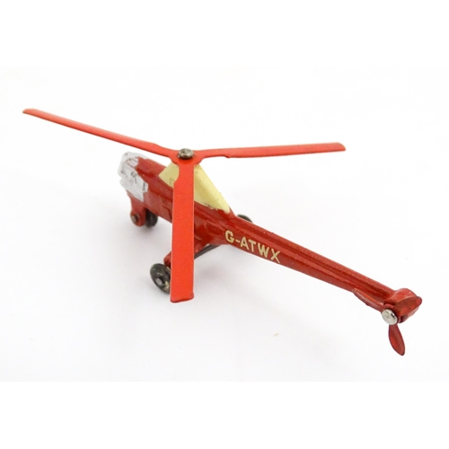 1272 - Toys: A boxed Dinky Toys die cast scale model of a helicopter no. 716. Together with three Moko Lesn... 