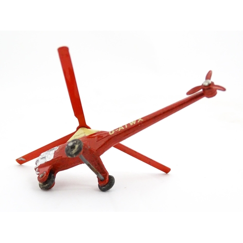 1272 - Toys: A boxed Dinky Toys die cast scale model of a helicopter no. 716. Together with three Moko Lesn... 