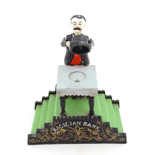 1273 - Toy: A 20thC cast metal novelty money box / piggy bank titled Magician Bank, modelled as a magician ... 