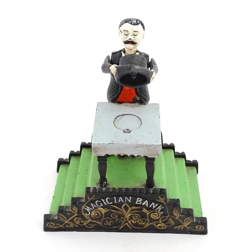 1273 - Toy: A 20thC cast metal novelty money box / piggy bank titled Magician Bank, modelled as a magician ... 