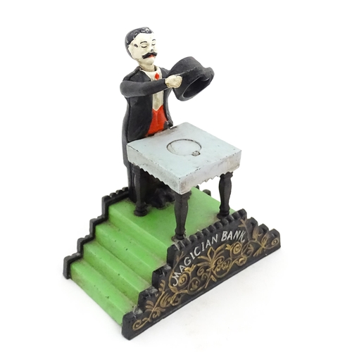 1273 - Toy: A 20thC cast metal novelty money box / piggy bank titled Magician Bank, modelled as a magician ... 