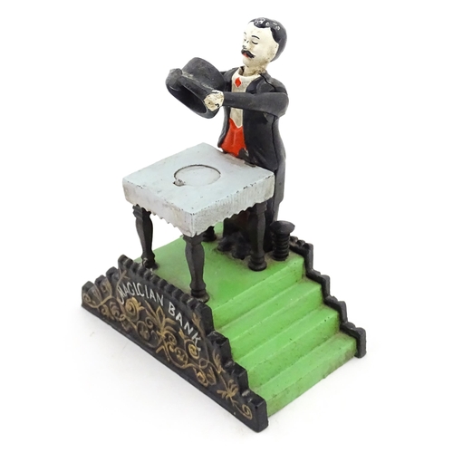 1273 - Toy: A 20thC cast metal novelty money box / piggy bank titled Magician Bank, modelled as a magician ... 