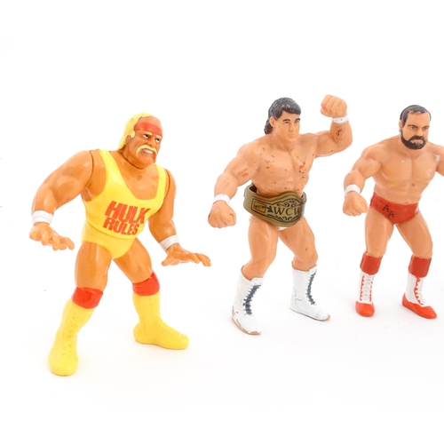 1276 - Toys: A 20thC WWF Wrestlemania wrestling ring, with Titan Sport American wrestler action figures to ... 