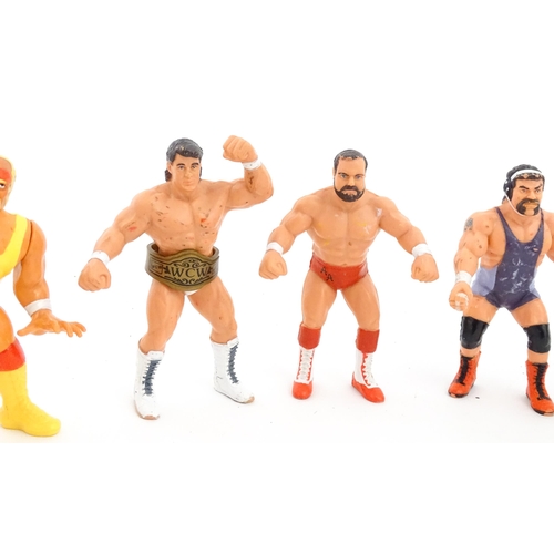 1276 - Toys: A 20thC WWF Wrestlemania wrestling ring, with Titan Sport American wrestler action figures to ... 