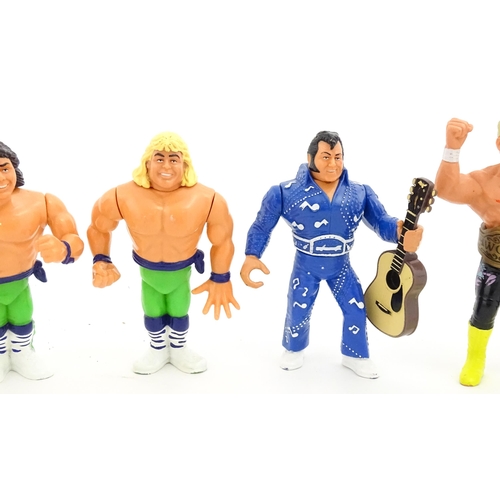 1276 - Toys: A 20thC WWF Wrestlemania wrestling ring, with Titan Sport American wrestler action figures to ... 