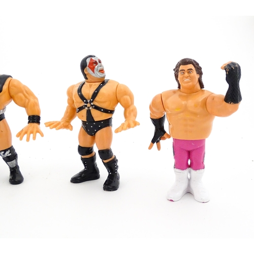 1276 - Toys: A 20thC WWF Wrestlemania wrestling ring, with Titan Sport American wrestler action figures to ... 