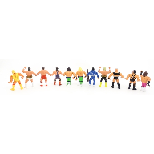 1276 - Toys: A 20thC WWF Wrestlemania wrestling ring, with Titan Sport American wrestler action figures to ... 